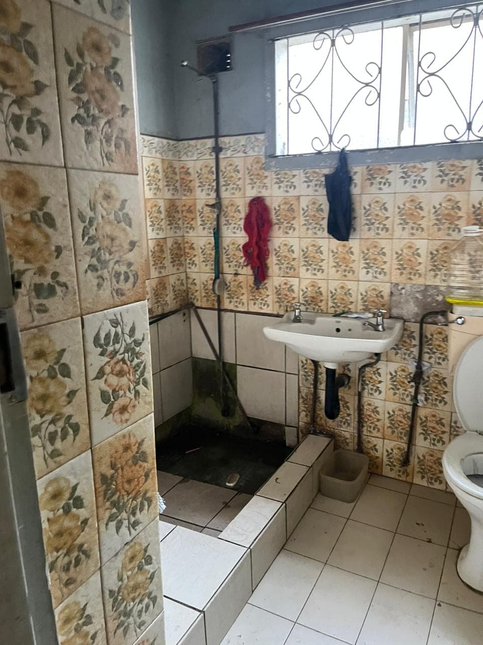 Before: water damage and outdated fittings